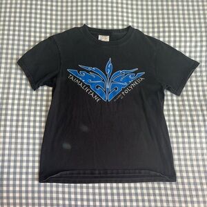 black baby tee with blue polynesian graphic